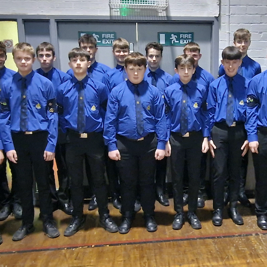 Members of Boys Brigade standing smartly in matching uniform